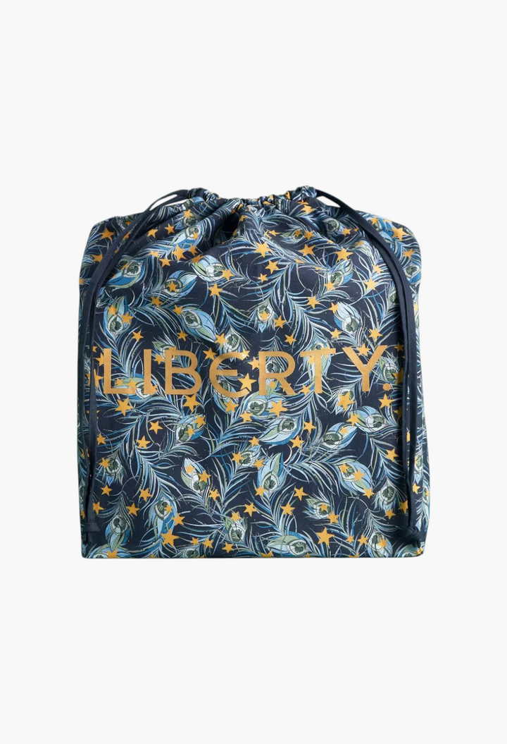 GLAM MODA beauty advent calendar drawstring bag featuring a navy blue Liberty peacock feather and star print