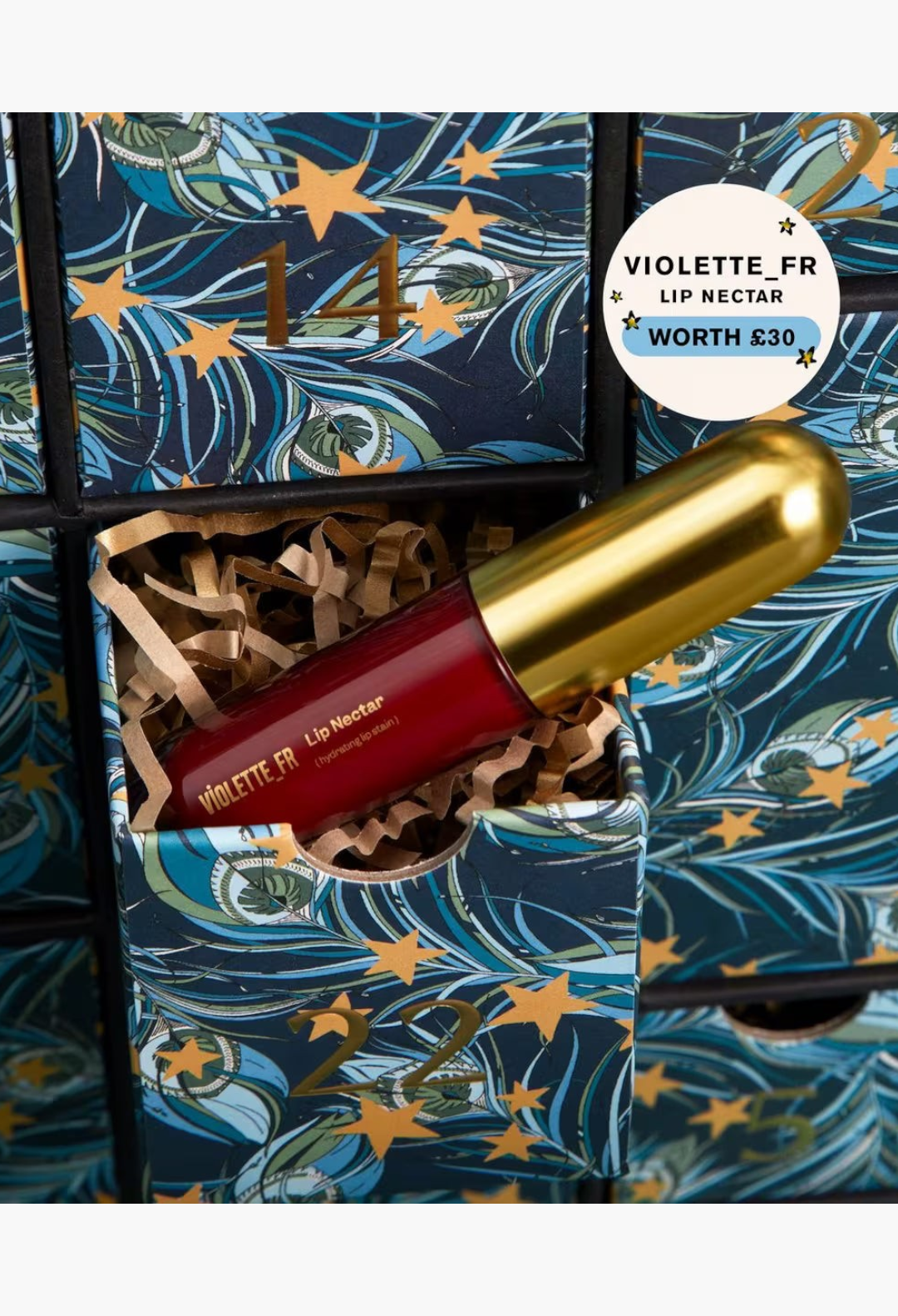 GLAM MODA Beauty Advent Calendar 2026 featuring a Violette FR Lip Nectar in a decorative peacock print drawer