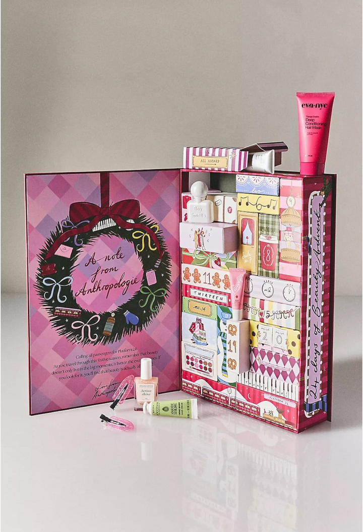 GLAM MODA 24 Days of Beauty Advent Calendar with whimsical Nephthys Foster illustrations and assorted skincare samples.