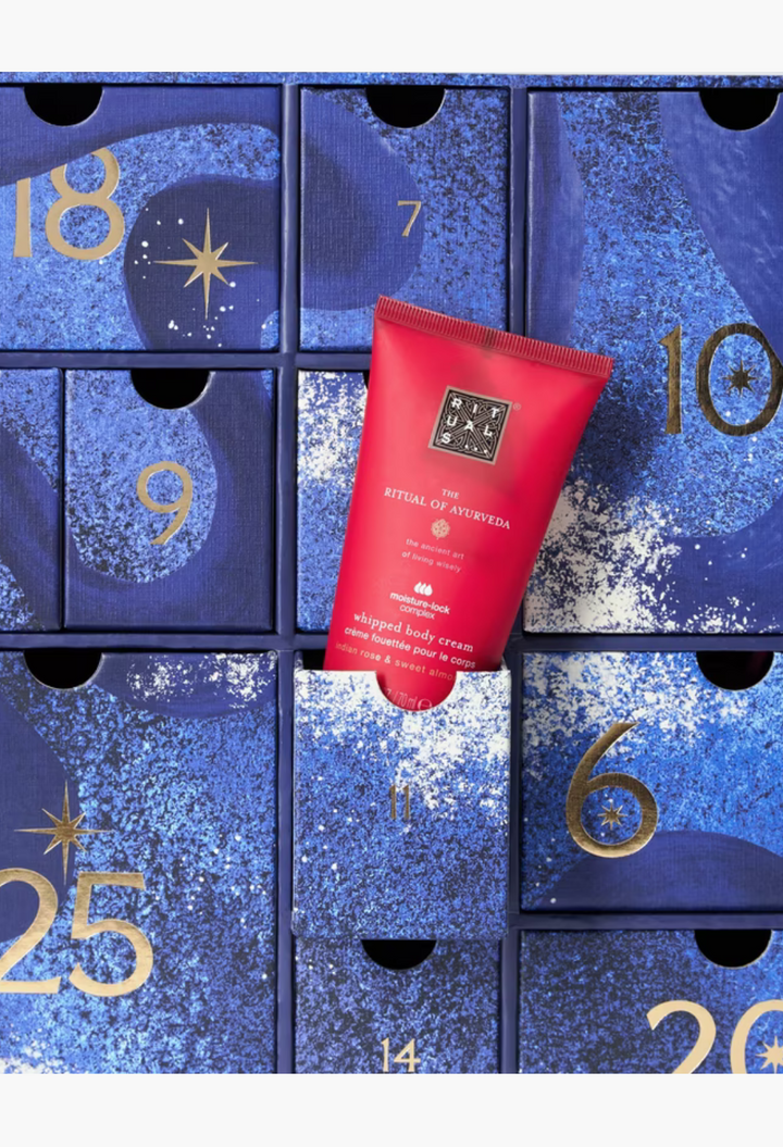 GLAM MODA beauty advent calendar featuring a red Rituals Ayurveda whipped body cream tube in a blue drawer