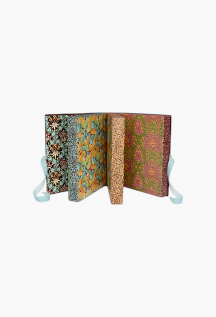 GLAM MODA William Morris At Home 2026 beauty advent calendar with Oak and Willow patterned book-style gift boxes.