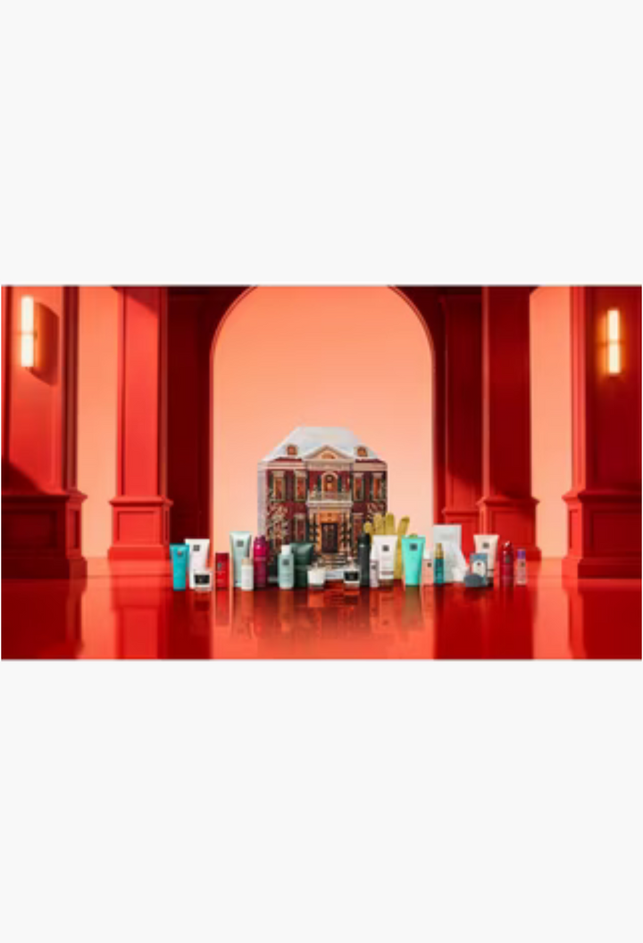 GLAM MODA Rituals Classic Advent Calendar house-shaped box surrounded by 24 bath, body, and home beauty products