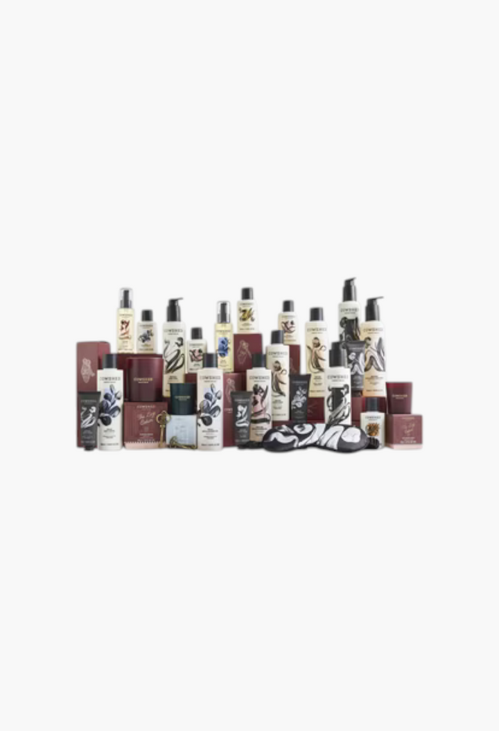 GLAM MODA Cowshed 24 day advent calendar featuring assorted skincare, body care, and candles in a festive collection