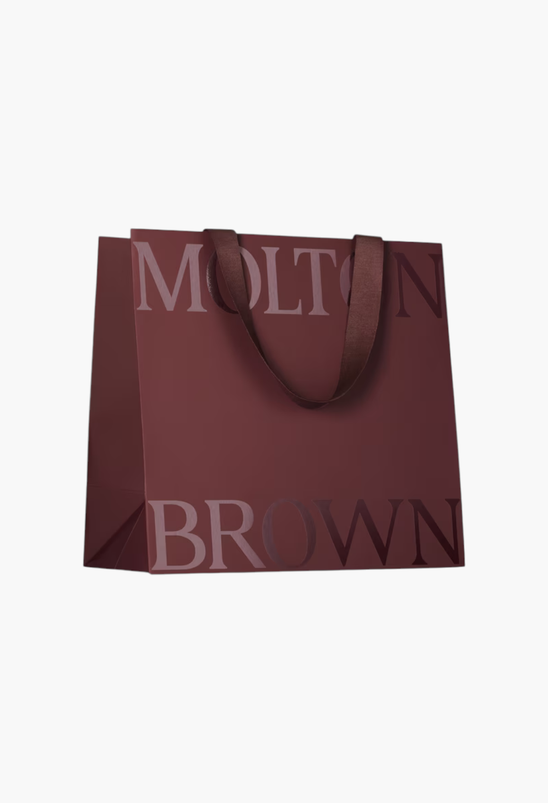 GLAM MODA branded deep red gift bag with dark brown ribbon handles and large embossed lettering