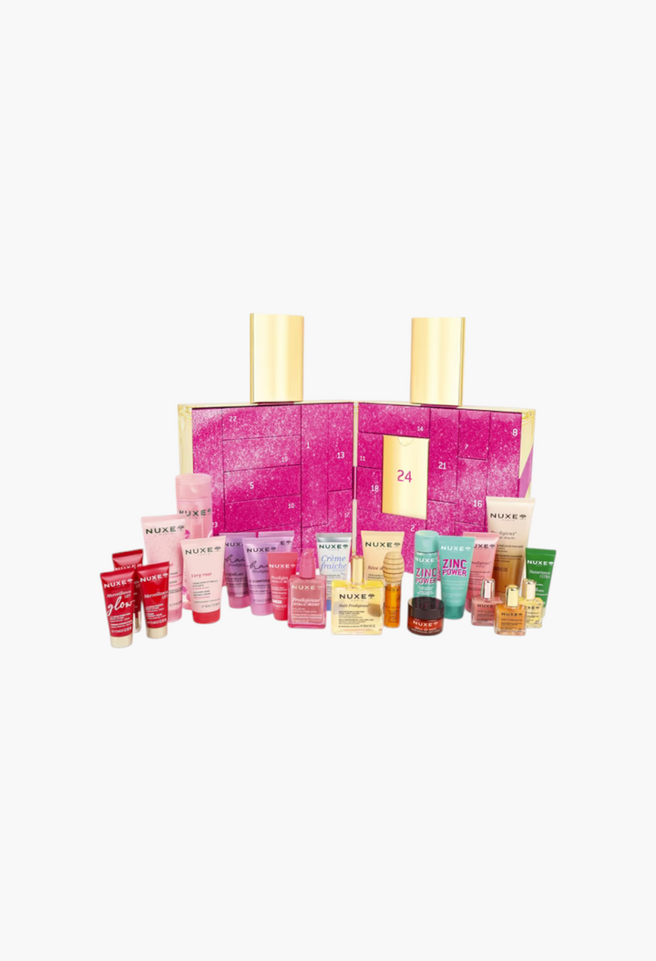 GLAM MODA Nuxe Advent Calendar featuring 24 beauty products including skincare, hair care, and oils in a pink box