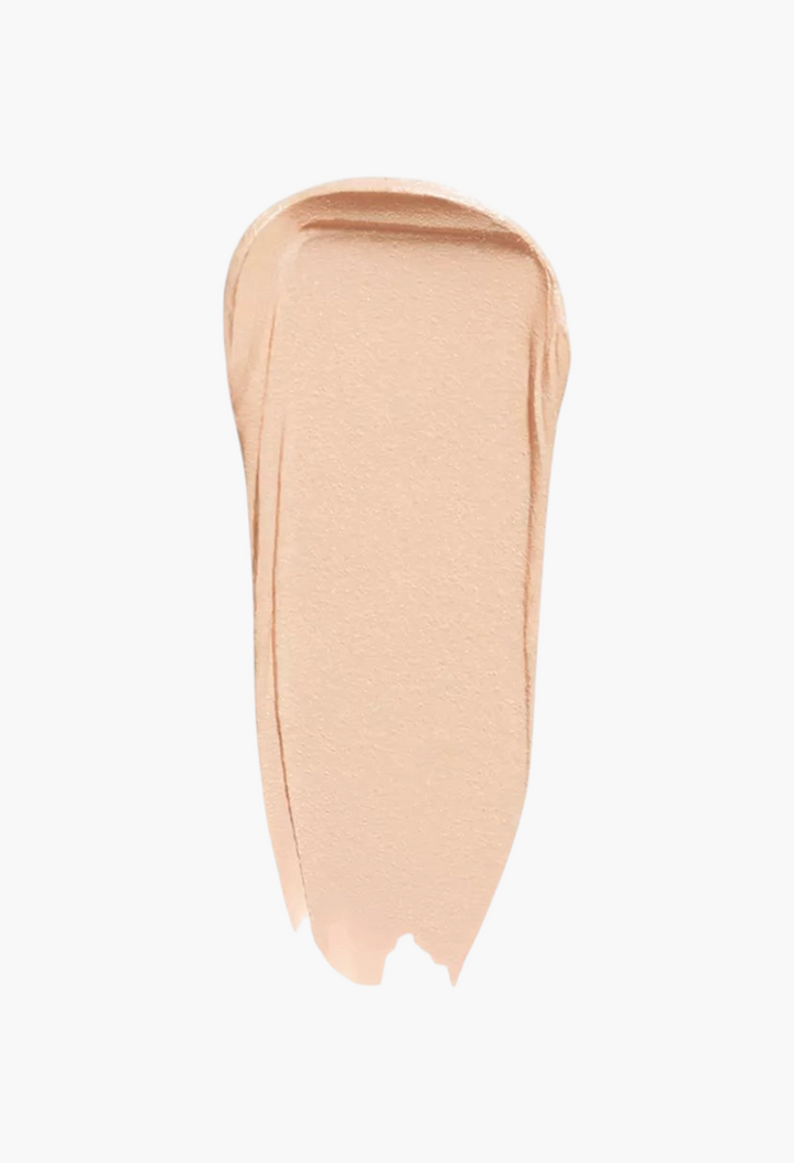 GLAM MODA Concealer SPF 27 swatch showing a creamy, light beige full-coverage formula texture on a white background.