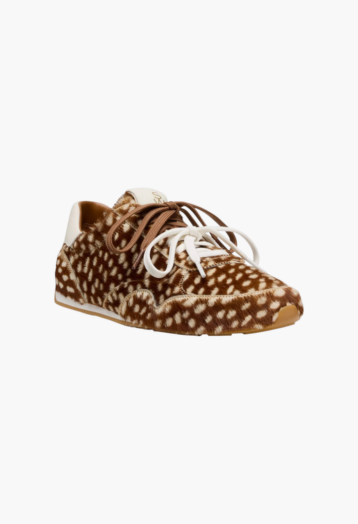 GLAM MODA Women's Bond Sport Sneakers in brown and white animal print calf hair with a rubber sole and lace-up front.
