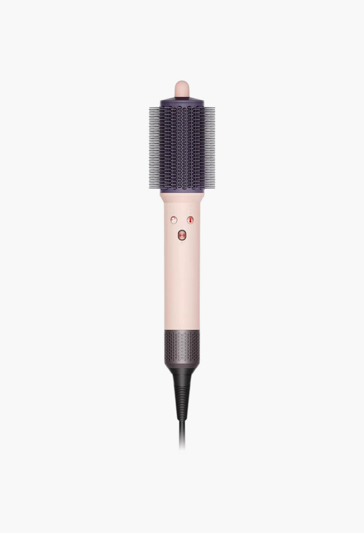 GLAM MODA Dyson Airsmooth styling brush in ceramic pink and rose gold with anti-snag bristles for hair volume.