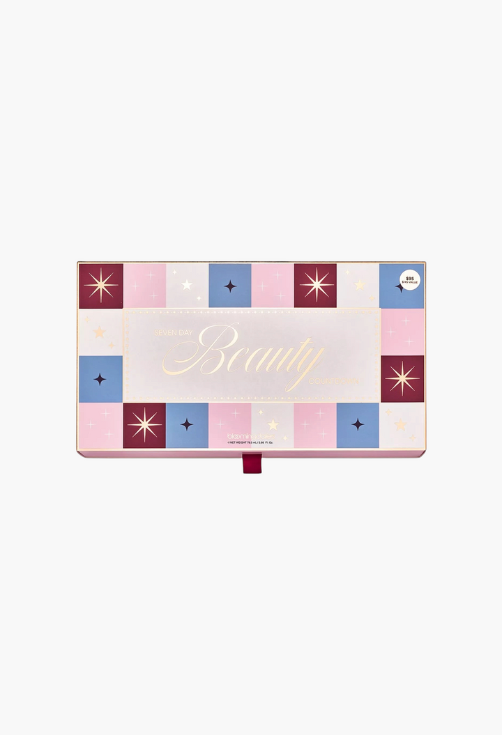 GLAM MODA 7 Day Beauty Countdown Advent Calendar gift box with festive pink, blue, and burgundy star pattern design.