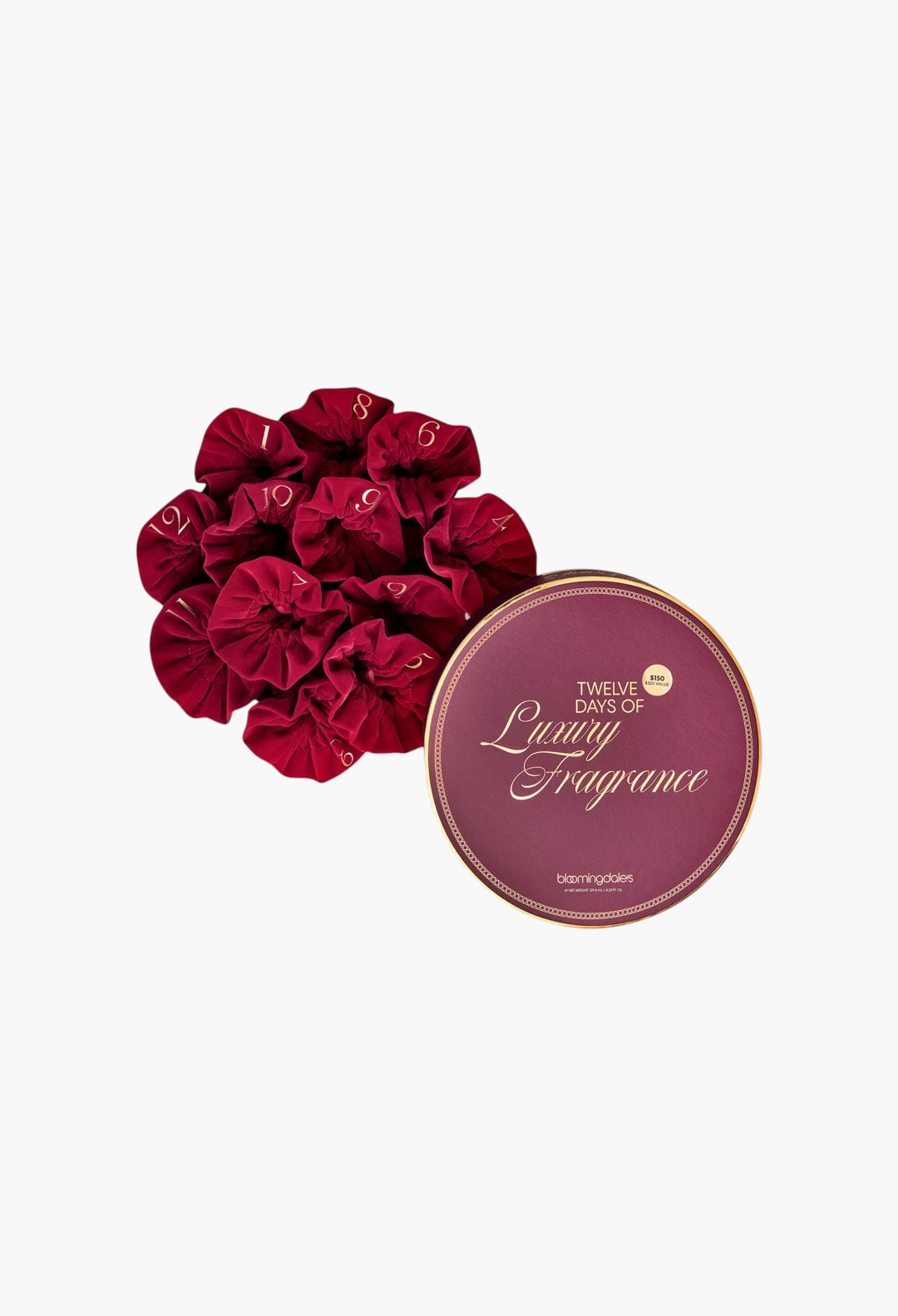 GLAM MODA 12 Days of Luxury Fragrance advent calendar featuring velvet red pouches and a round gold-trimmed gift box.