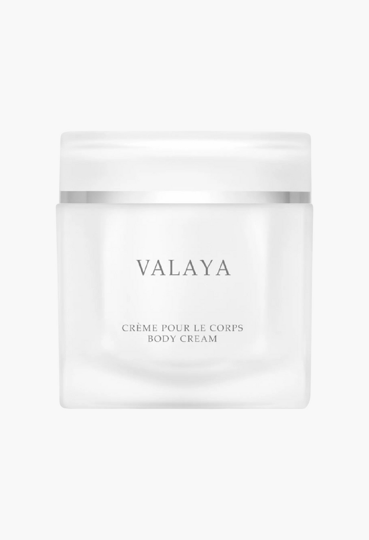 GLAM MODA Valaya refillable body cream in a minimalist frosted glass jar with silver accents.