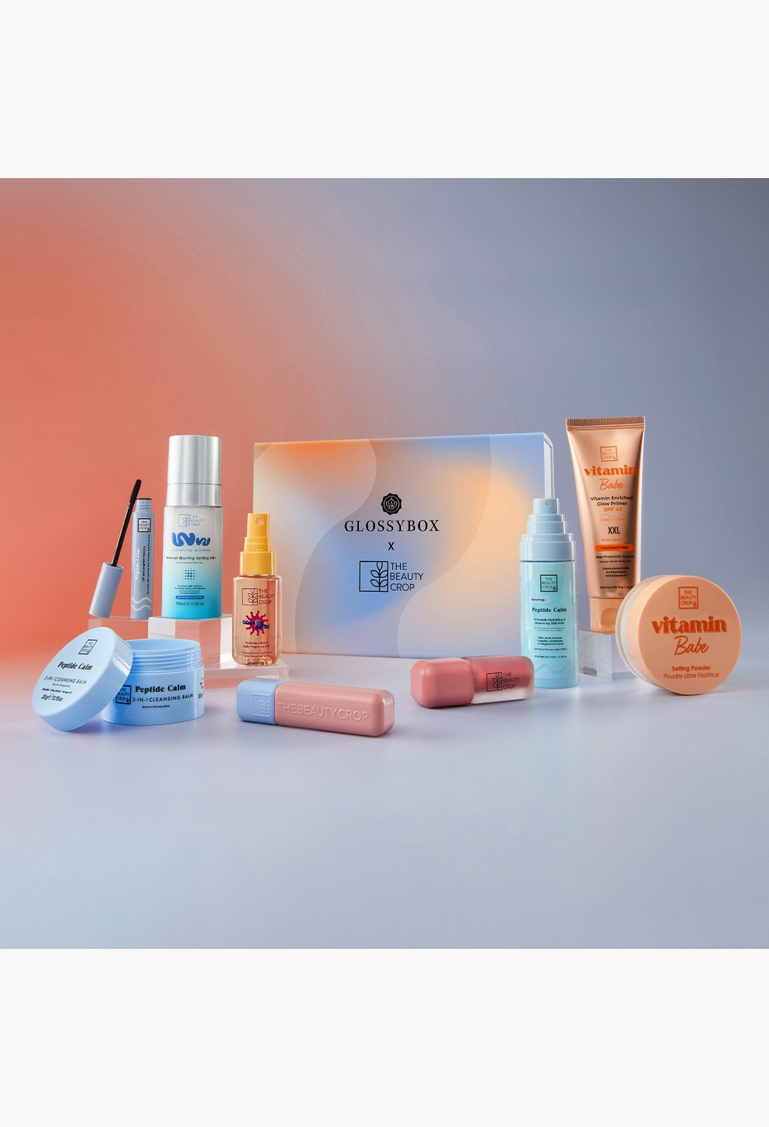 GLAM MODA GLOSSYBOX x The Beauty Crop limited edition beauty set featuring skincare and makeup products on a gradient