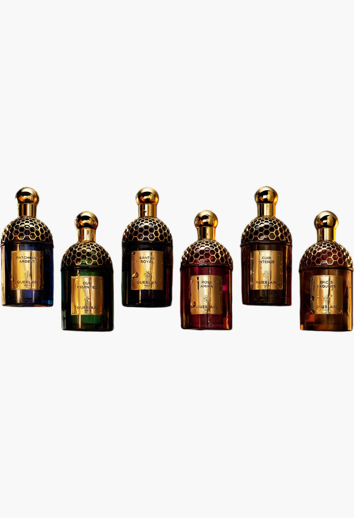 GLAM MODA collection of six Guerlain Absolus Allegoria perfume bottles with iconic gold honeycomb caps