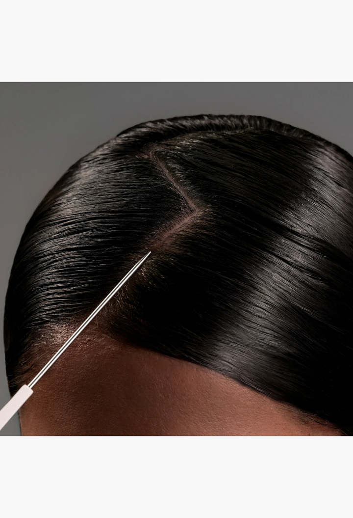 GLAM MODA parting tail comb with stainless steel tip creating a precise clean part in sleek dark hair