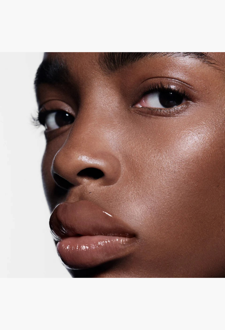 GLAM MODA Posh Balm Nourishing Lip Shine on a model with a glossy, hydrated finish and natural, sheer tint.