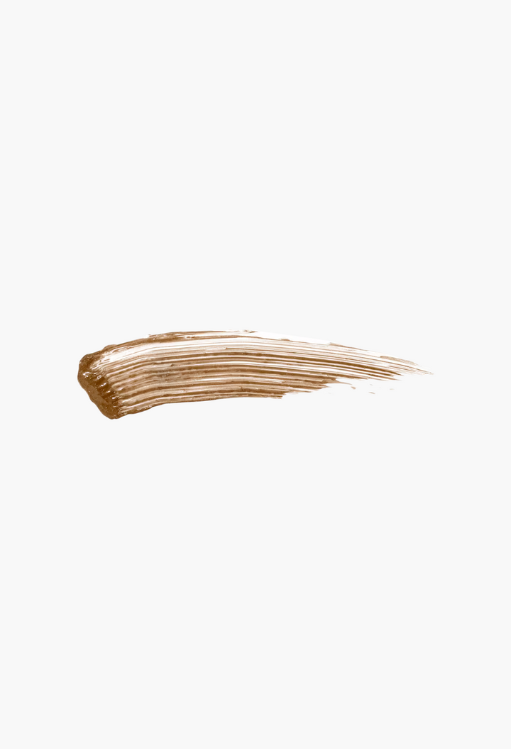 GLAM MODA Gimme Brow+ tinted eyebrow gel swatch showing a smooth, light brown creamy texture on a white background.