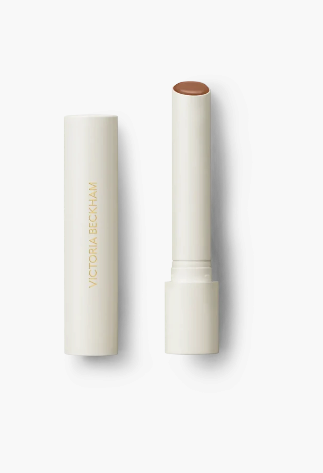 GLAM MODA Posh Balm nourishing lip shine in a sleek cream-coloured twist-up tube with a brown tinted balm bullet.
