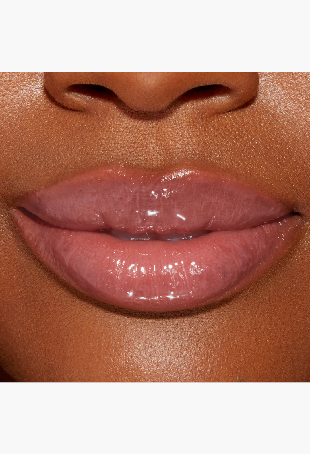 GLAM MODA Lip Injection Power Plumping Lip Gloss in a warm rosy nude shade with a high-shine, volumizing finish.