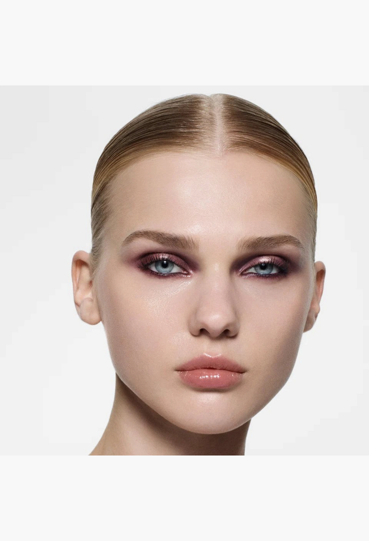 Model wearing a deep, smoky plum eyeshadow look created with the GLAM MODA Eye Wardrobe Multi-Finish Palette