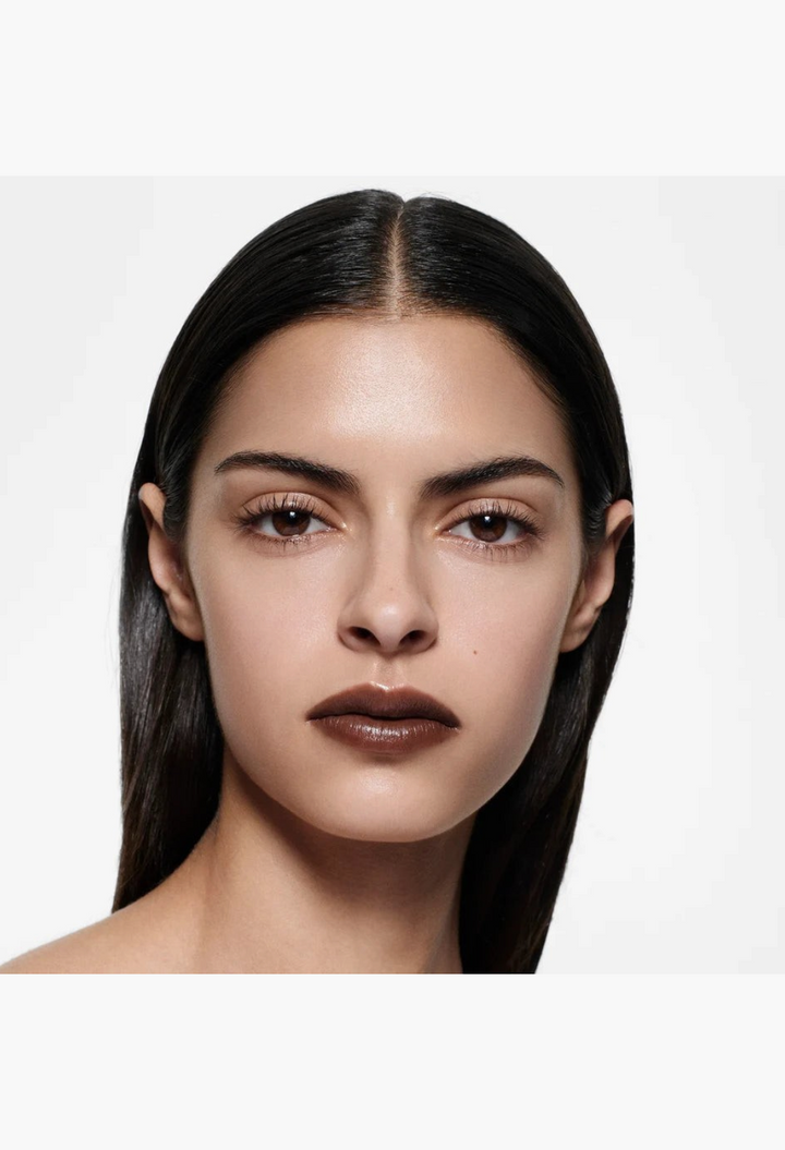 GLAM MODA Posh Lipstick in Spice, a mid-tone ginger shade, worn by a model with a natural, glowing complexion.