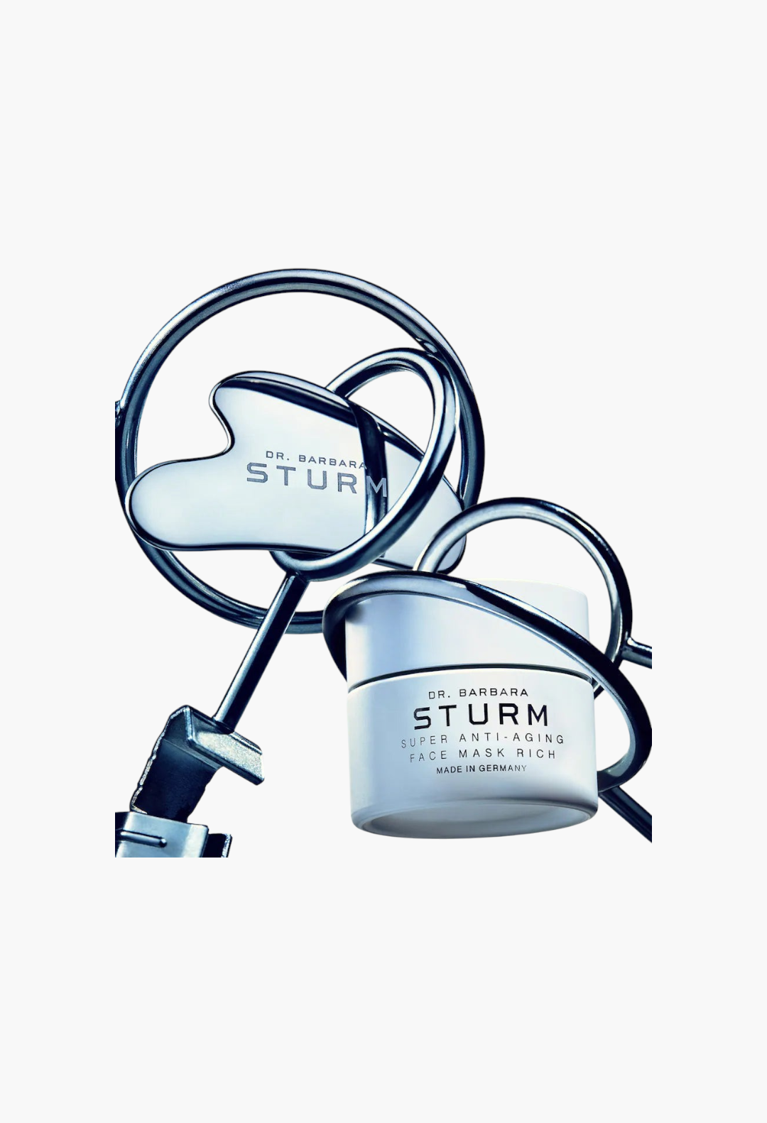 GLAM MODA Dr. Barbara Sturm Super Anti-Aging Face Mask Rich jar and gua sha tool for skin hydration and elasticity.
