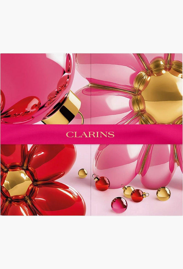 GLAM MODA Clarins 12-Day Beauty Advent Calendar featuring festive pink and red floral designs with gold accents.