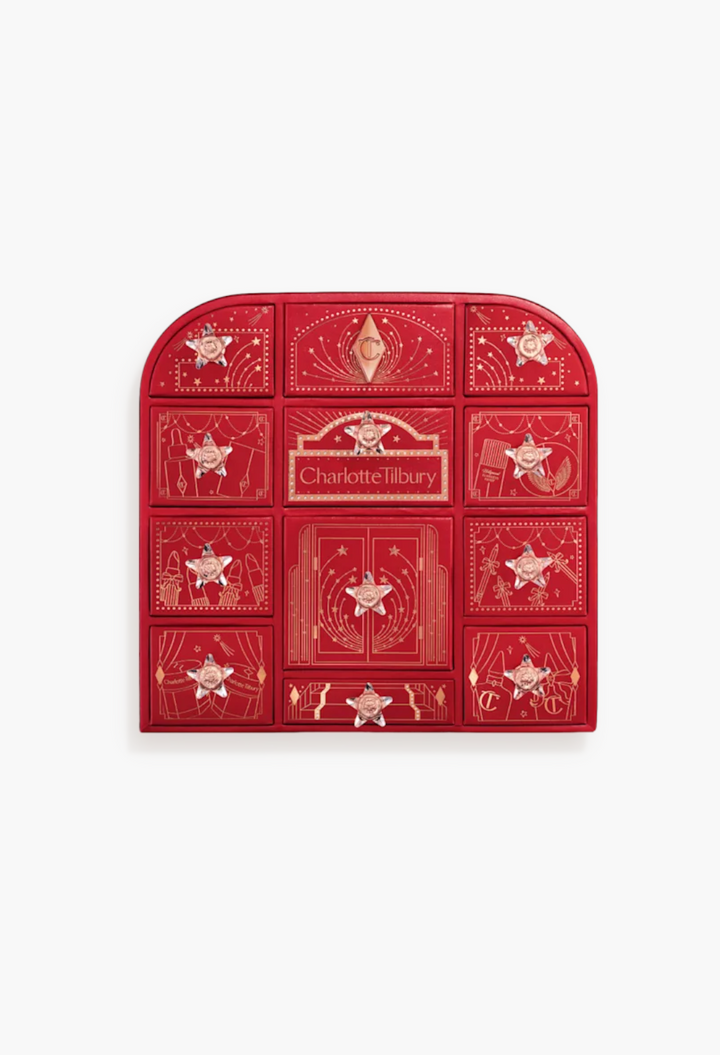 GLAM MODA Charlotte Tilbury Hollywood Beauty Wonderland advent calendar in red with gold star-shaped drawer handles.