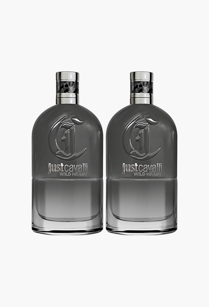 GLAM MODA Just Cavalli Wild Heart Eau de Toilette set featuring two 90ml grey glass perfume bottles with silver caps.