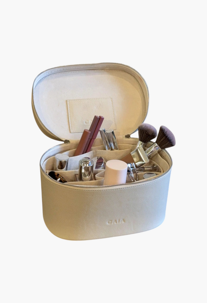 GLAM MODA brown vegan leather beauty case with removable interior organizer filled with makeup brushes and cosmetics