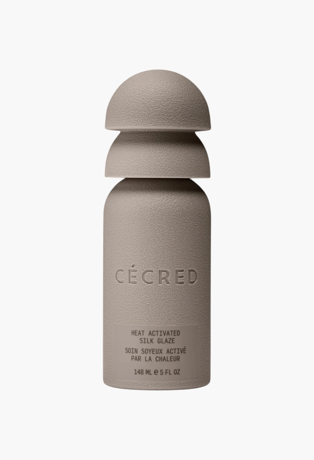 GLAM MODA Cécred Heat Activated Silk Glaze bottle in a matte beige finish with a unique stacked cap design.