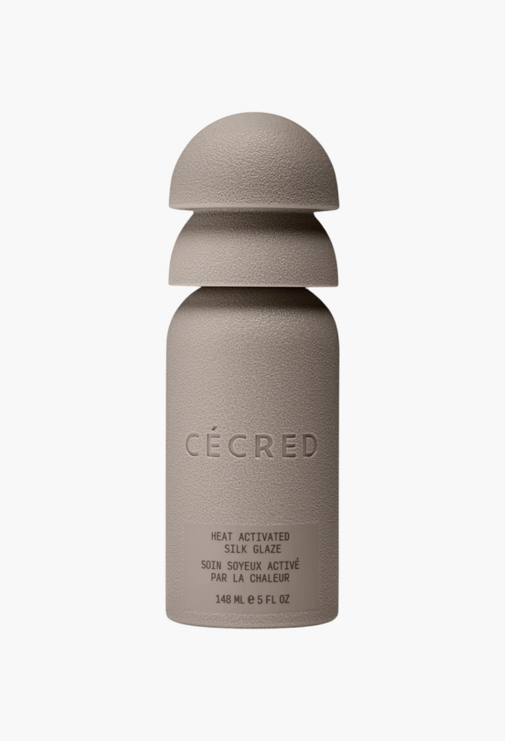 GLAM MODA Cécred Heat Activated Silk Glaze bottle in a matte beige finish with a unique stacked cap design.