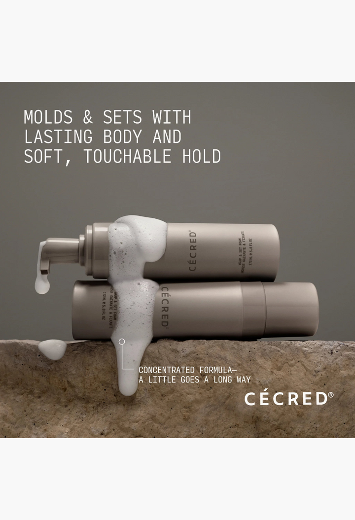 GLAM MODA Braid-Out Bundle featuring two beige bottles of Wrap & Set Foam with white foam texture on a stone surface.