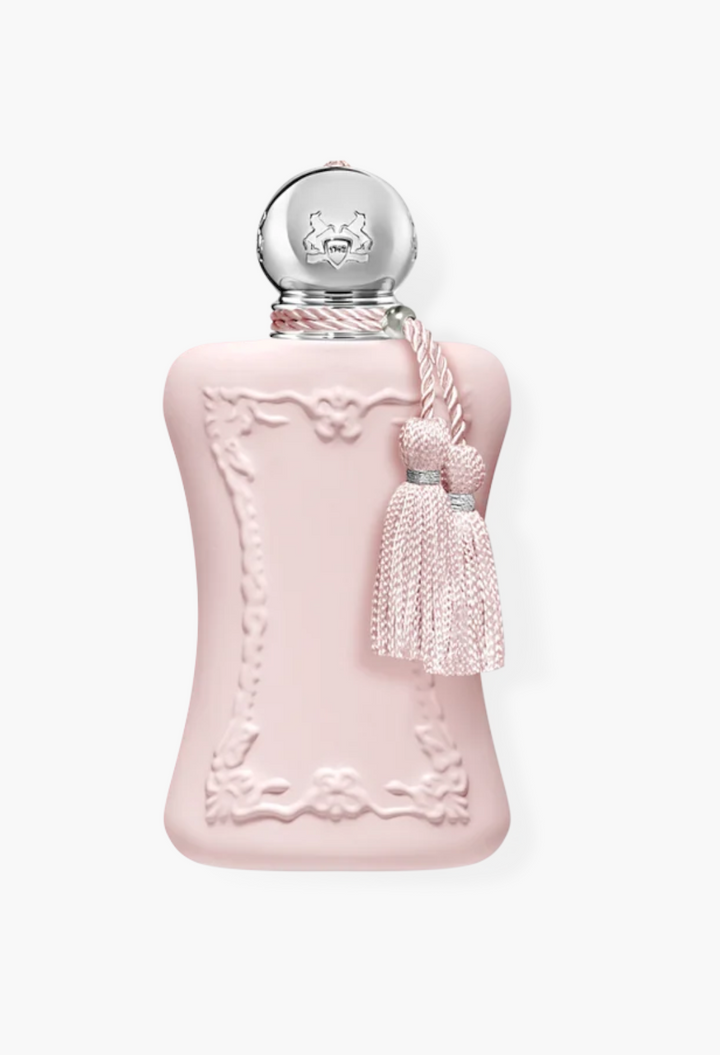 GLAM MODA Delina perfume bottle in soft pink with ornate floral detailing, silver cap, and decorative tassel.