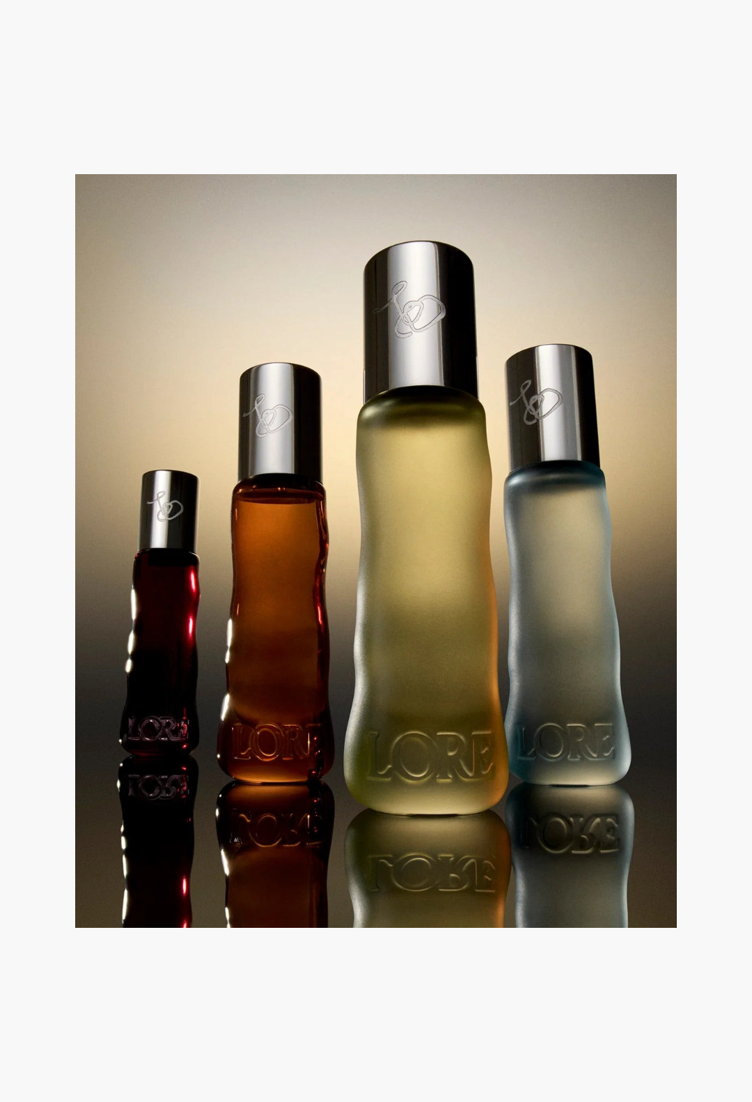GLAM MODA LORE perfume set featuring four 10ml glass fragrance bottles in various colors with silver caps
