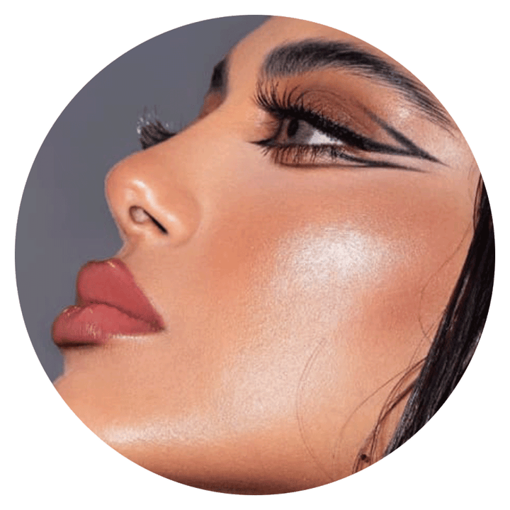 woman's face with dramatic makeup