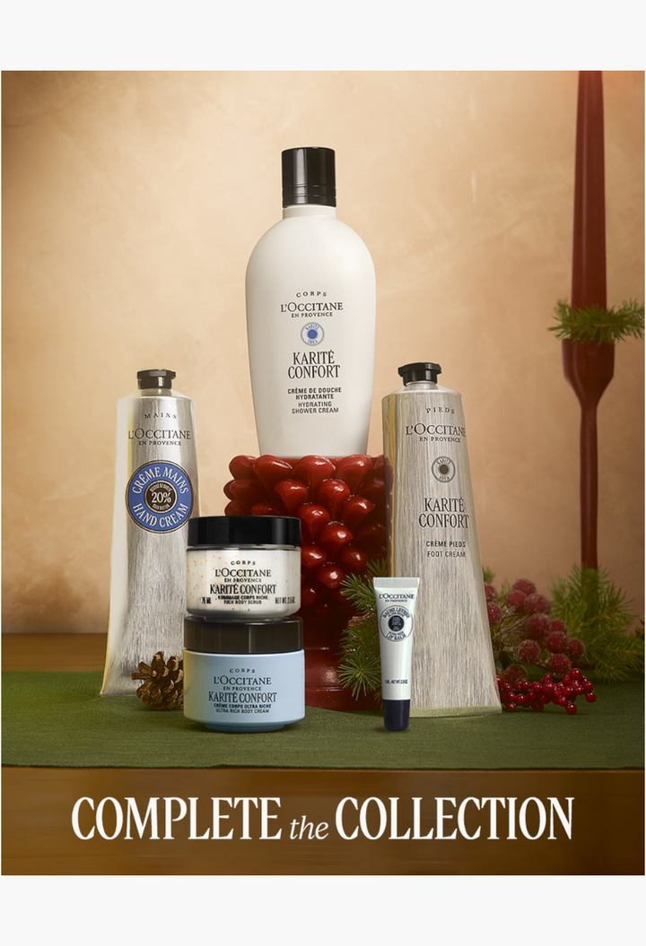 GLAM MODA luxury skincare set featuring L'Occitane body creams, hand creams, and shower oil in a festive holiday display.