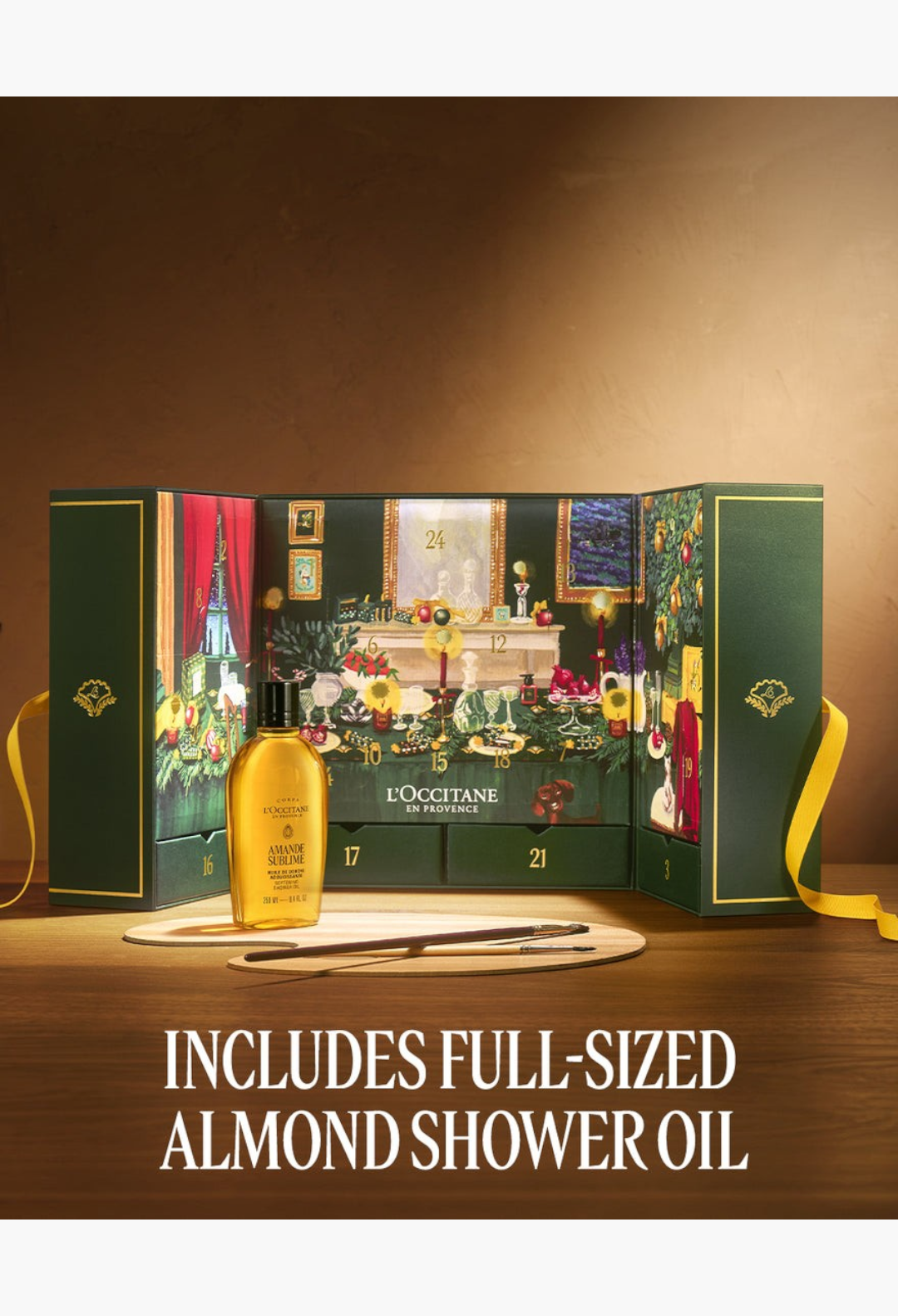 GLAM MODA Prestige Advent Calendar featuring a festive green gift box with 24 compartments and Almond Shower Oil.