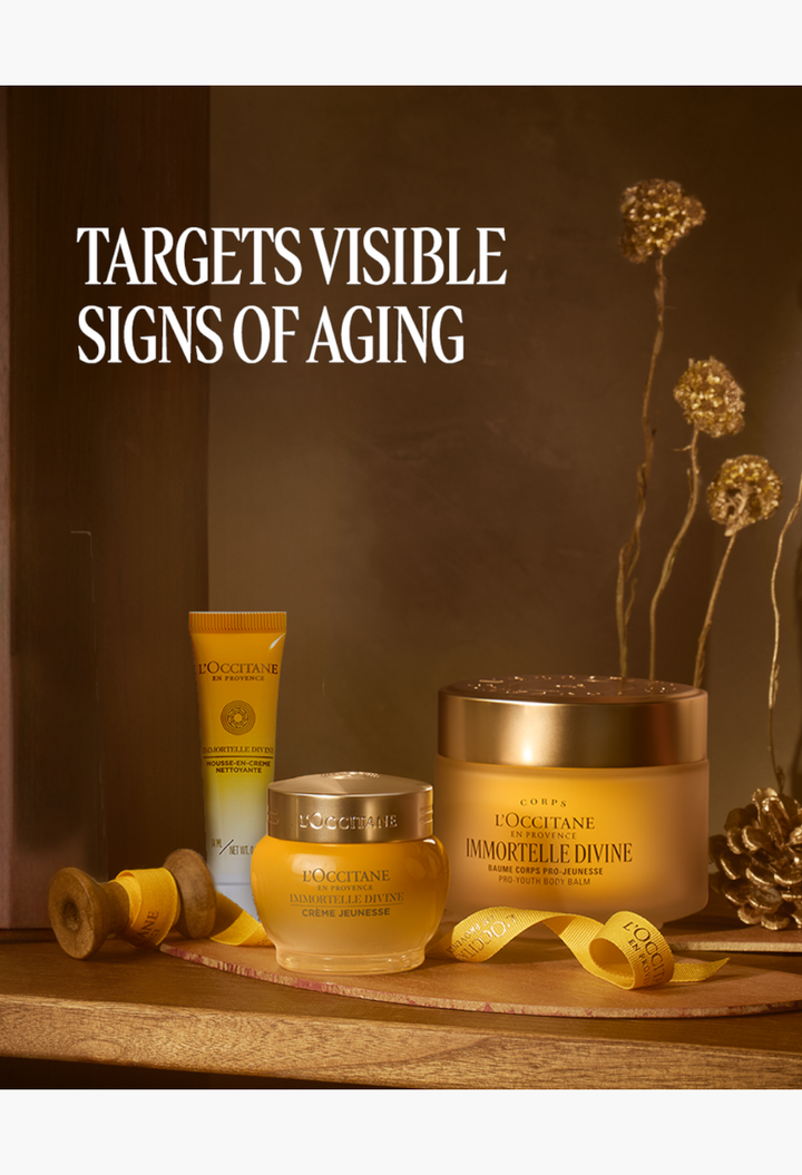 GLAM MODA L'Occitane Immortelle Divine anti-aging skincare set featuring face cream, foaming cleanser, and body balm.