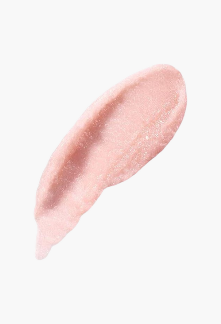 GLAM MODA The Lip Polish exfoliating balm swatch showing a soft pink, grainy texture for smoothing dry lips.