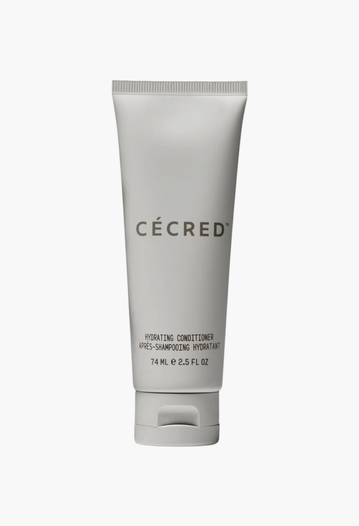 GLAM MODA Cécred Hydrating Conditioner in a white squeeze tube for all hair types on a neutral background.