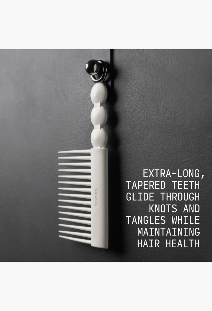 GLAM MODA Rake Comb in off-white with extra-long tapered teeth and a metal ring for hanging storage