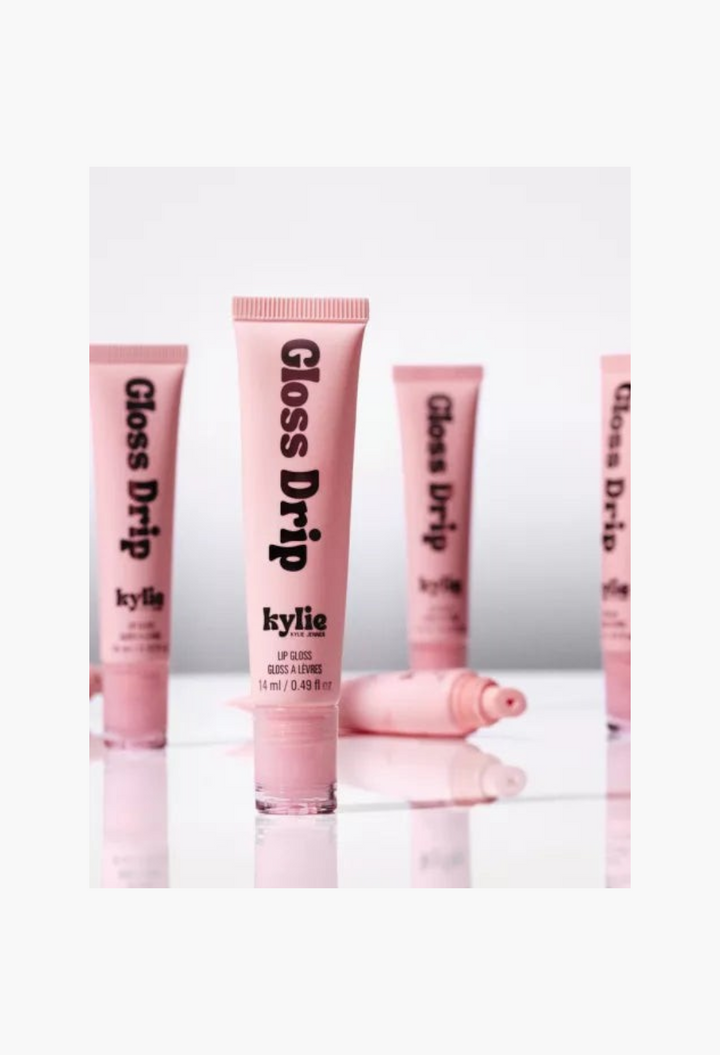 GLAM MODA Kylie by Kylie Jenner Gloss Drip lipgloss in a pink squeeze tube for a high-shine mirror finish