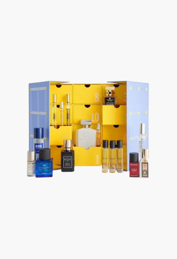GLAM MODA Fragrance Advent Calendar 2026 featuring various luxury perfume bottles displayed in a yellow drawer box.
