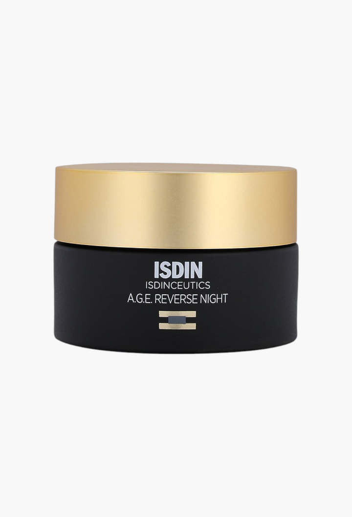 GLAM MODA Isdinceutics A.G.E. Reverse Night Cream in a matte black jar with a gold lid on a white background.