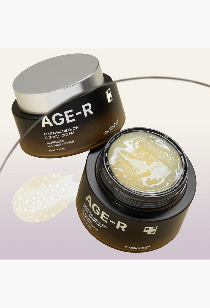 GLAM MODA AGE-R Glutathione Glow Capsule Cream in a black jar with a silver lid, showing the translucent gel texture.