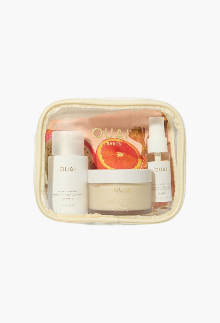 GLAM MODA OUAI St. Barts travel kit featuring body cleanser, body creme, and hair and body mist in a clear pouch.