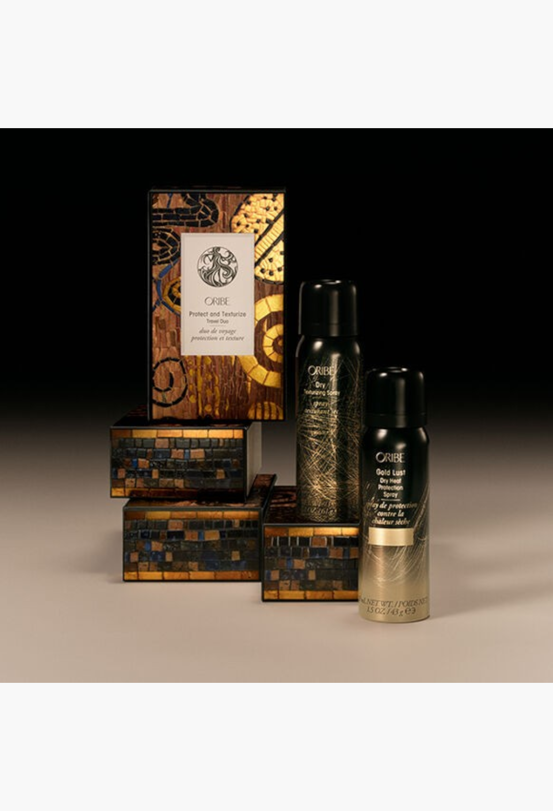 GLAM MODA Oribe Protect and Texturize Travel Duo set featuring heat protection and dry texturizing hair sprays.