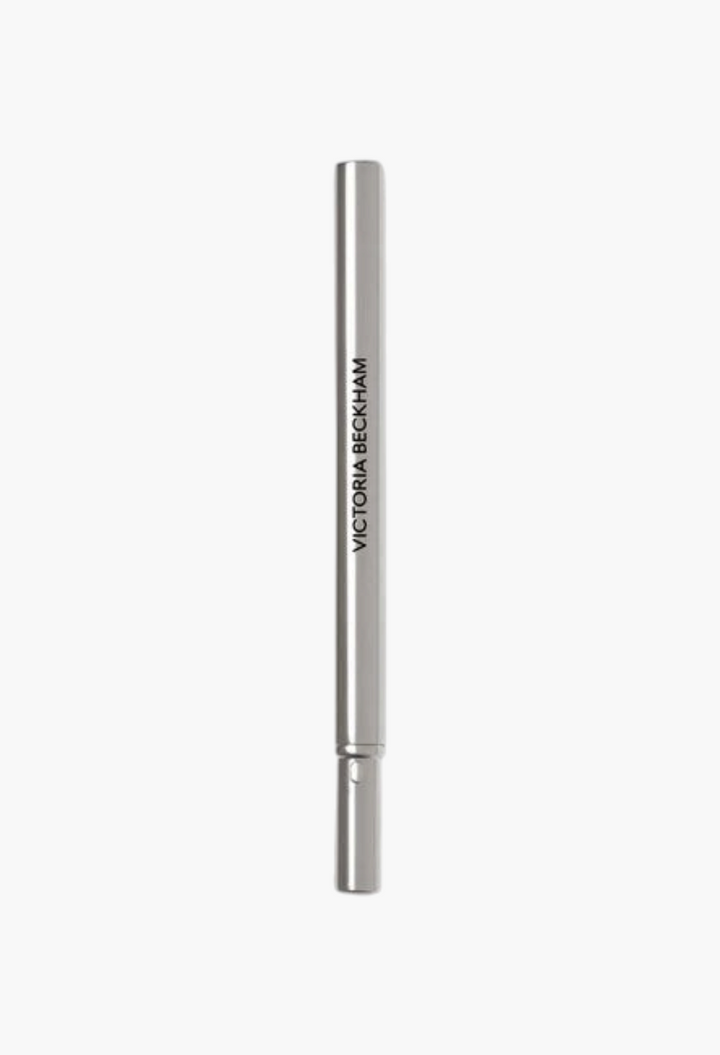 GLAM MODA Victoria Beckham Beauty Lip Definer lip pencil in a sleek silver casing for precise lip contouring.