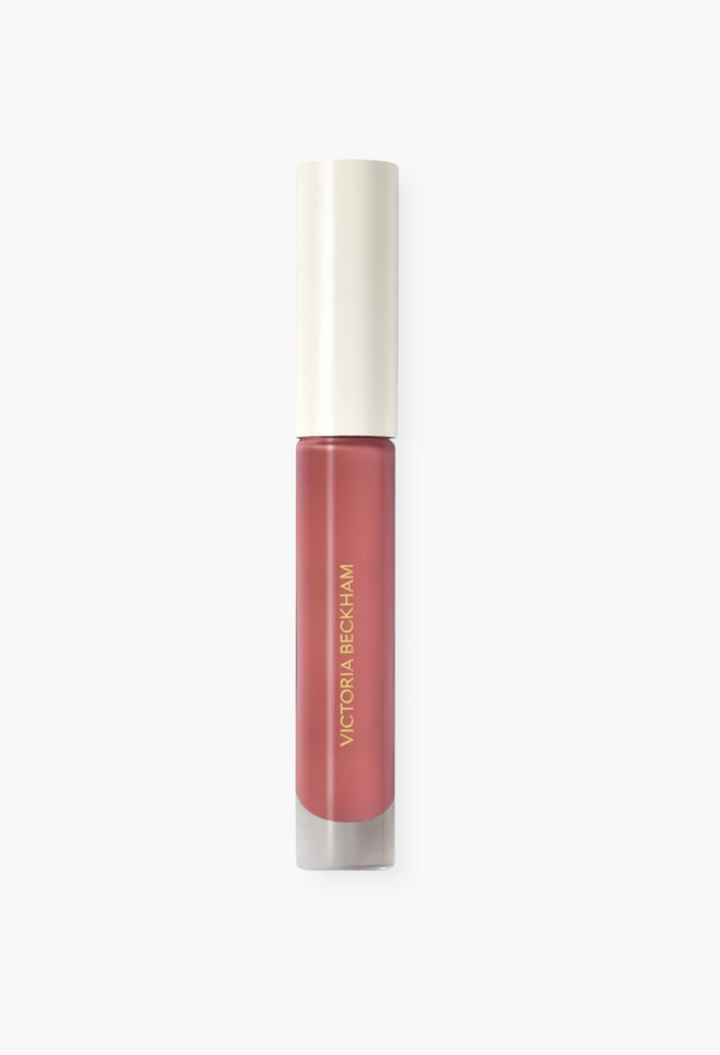 GLAM MODA Posh Gloss high-shine lip gloss in a mauve-pink shade with a white cap and sleek applicator tube.