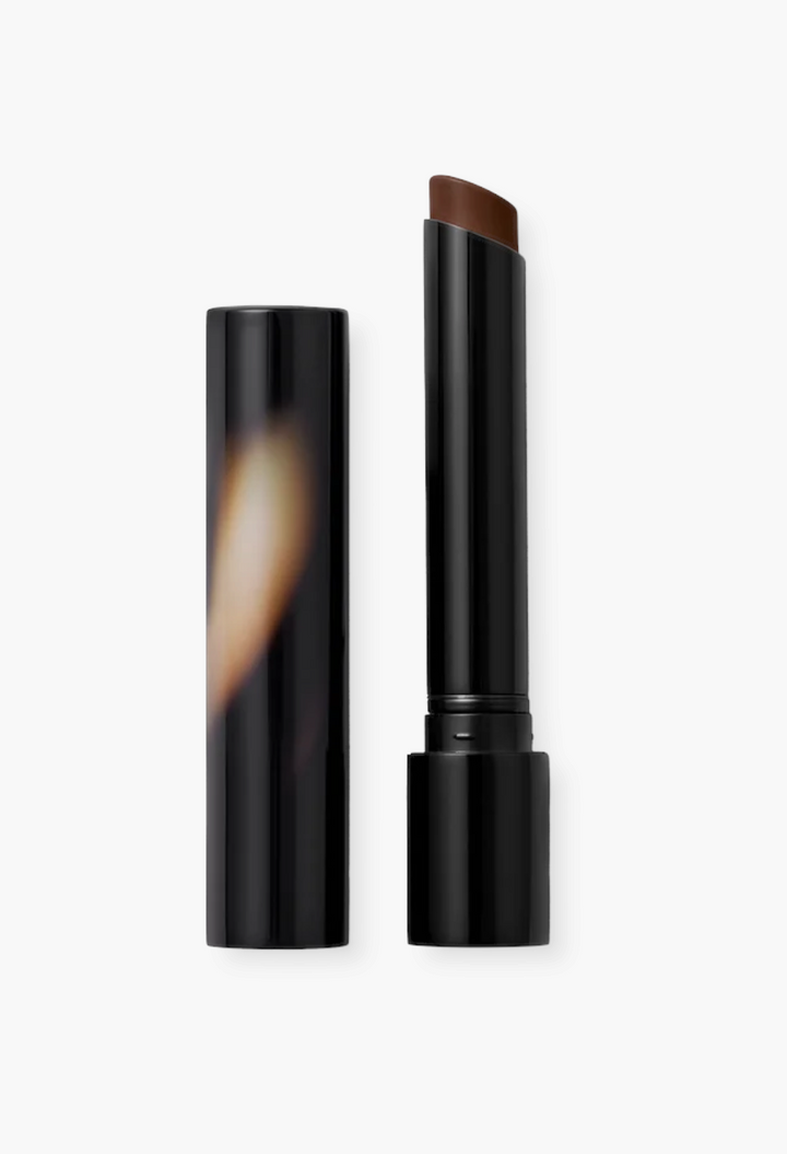 GLAM MODA Posh Lipstick in Spice, a moisturizing ginger-toned lipstick in a sleek black tube with cap removed.